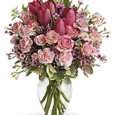 It's beauty-full! Bursting with tantalizing tulips and radiant roses, this delightful pink arrangement brings spring joy to that special someone.
Includes pink roses, tulips, carnations and waxflower, accented with fresh pitta negra and variegated pittosporum.
Delivered in a lovely glass vase.